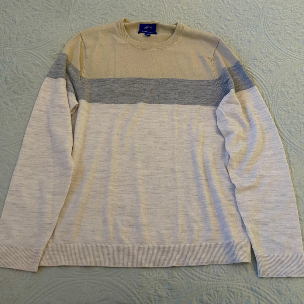 Apt. 9 defines handsome style with this Merino colorblock crewneck sweater.